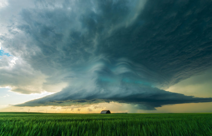 A supercell thunderstorm over a barn on the canadian prairies