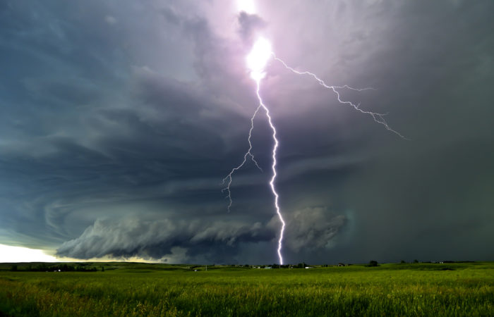 A lightning bolt through a supercell thunderstorm during a storm chase